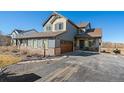 Beautiful two-story home featuring a well-kept front yard and a two-car garage at 42225 Kingsmill Cir, Elizabeth, CO 80107