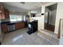 Well-equipped kitchen with stainless steel appliances and a tiled floor that connects to the living area at 3656 W 77Th Ave, Westminster, CO 80030