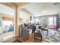 Comfortable living room featuring hardwood floors and an open layout to the kitchen at 3656 W 77Th Ave, Westminster, CO 80030