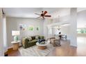 Bright living room with vaulted ceilings, hardwood floors, and stylish furnishings at 1936 E 144Th Dr, Thornton, CO 80602