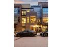 A modern brown brick townhome featuring sleek architectural details and street parking creates an inviting facade at 2900 Inca St # 7, Denver, CO 80202
