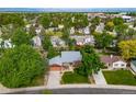 An aerial shot showcasing the neighborhood's lush greenery and convenient location with mountain views at 17372 E Prentice Cir, Centennial, CO 80015