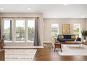 Inviting living room with large windows, hardwood floors, and modern furnishings at 2374 S University Blvd # 202, Denver, CO 80210