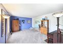 Cozy living room with neutral carpet and ample space for furnishings and decor at 225 Berthoud Way, Golden, CO 80401