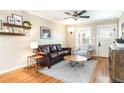 Comfortable living room with hardwood floors, a ceiling fan, and stylish furnishings at 2074 S Emerson St, Denver, CO 80210