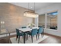 Elegant dining room with a modern chandelier and large windows at 9524 Fork Bluff Pt, Lone Tree, CO 80124