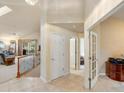 Inviting foyer with tile flooring that leads to the living room and staircase at 7158 W Belmont Dr, Littleton, CO 80123