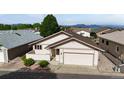 Inviting single-Gathering home with an attached garage and lush landscaping, creating an appealing and welcoming facade at 23 Carla Way, Broomfield, CO 80020