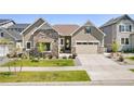 Charming single-Gathering home with stone accents, inviting curb appeal and a well-manicured lawn at 6950 S Yantley Ct, Aurora, CO 80016