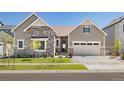 Charming single-Gathering home with stone accents, inviting curb appeal and a well-manicured lawn at 6950 S Yantley Ct, Aurora, CO 80016