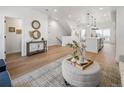 Spacious living room with hardwood floors, neutral decor, and an open concept layout at 4511 Tabor St, Wheat Ridge, CO 80033