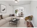 Bright living room with neutral tones, featuring a dining area and stylish decor for comfortable living at 85 Uinta Way # 405, Denver, CO 80230