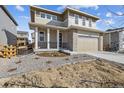 Stylish two-story home with a cozy front porch and a two-car garage at 24769 E 39Th Ave, Aurora, CO 80019