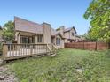 Expansive backyard with a wooden deck, perfect for outdoor entertaining at 6154 Quitman St, Arvada, CO 80003