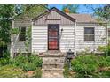 Welcoming single-Gathering home with tidy landscaping, enhancing curb appeal at 5674 S Prescott St, Littleton, CO 80120