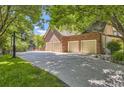 Spacious four-car garage with a basketball hoop, perfect for car enthusiasts and sports lovers at 4681 S Columbine Ct, Cherry Hills Village, CO 80113