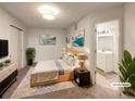 Virtually staged main bedroom with ensuite bathroom and closet at 1825 Kendall St # 215, Lakewood, CO 80214