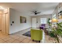 Inviting living area with tile floors, ceiling fan, and stylish decor featuring comfortable seating at 999 Osceola St, Denver, CO 80204