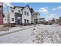 Modern two-story house featuring a white facade and dark stone accents at 1933 W 165Th Way, Broomfield, CO 80023