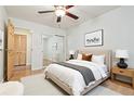 Serene bedroom with a large bed, mirrored closet doors, and soft natural light at 5995 W Hampden Ave # 3E, Denver, CO 80227