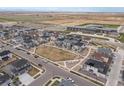 Aerial view of a new community with a park and school nearby at 24333 E 41St Ave, Aurora, CO 80019