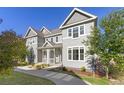 Inviting two-story townhome with covered porch and well-maintained landscaping at 1678 Wright Aly, Erie, CO 80516