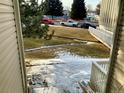 A view from the apartment door with an outdoor space, neighborhood street and street parking at 14172 E Colorado Dr # 204, Aurora, CO 80012