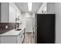 Modern kitchen with white cabinets and stainless steel appliances at 50 E Highline Cir # 102, Centennial, CO 80122