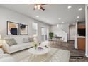 Bright, open-concept living room with hardwood floors, neutral palette, and ample natural light at 4770 N Jasper St, Denver, CO 80239
