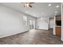 Spacious living room featuring elegant wood flooring and neutral wall color at 4770 N Jasper St, Denver, CO 80239