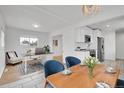 Bright, open-concept living space features a modern kitchen, dining area, and office space with ample natural light at 3001 Fairfax St, Denver, CO 80207