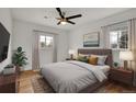 Cozy main bedroom features hardwood floors, neutral tones, ample natural light, and a ceiling fan at 3001 Fairfax St, Denver, CO 80207