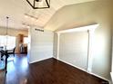 Spacious room featuring hardwood floors, high ceilings, and decorative trim at 18997 E Crestridge Cir, Aurora, CO 80015