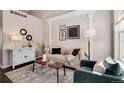 Stylish living room featuring chic furniture, modern art, and elegant decor at 18997 E Crestridge Cir, Aurora, CO 80015