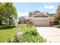 Inviting two-story home with a lush front yard and a convenient two-car garage at 4547 Tally Ho Trl, Boulder, CO 80301