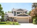 Charming two-story home with a well-manicured lawn and a two-car garage at 4547 Tally Ho Trl, Boulder, CO 80301