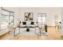 Bright living room with lots of natural light and neutral decor, offering a comfortable and stylish space at 4547 Tally Ho Trl, Boulder, CO 80301