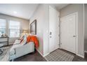 Cozy living room with a comfortable gray sofa, and stylish decor at 11450 Booth Falls Ct, Parker, CO 80134