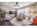 Bright living room with large windows, comfortable seating, and modern decor, great natural light at 11450 Booth Falls Ct, Parker, CO 80134