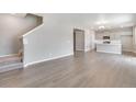 Spacious living room with stairs, hardwood floors and abundant natural light at 1854 Westport Ave, Berthoud, CO 80513