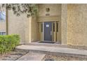 Close-up of the front entrance featuring a secure door and building number for easy identification at 7455 E Quincy Ave # 103, Denver, CO 80237