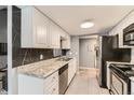 Well-equipped kitchen featuring stainless steel appliances, granite countertops, and ample cabinet space at 8100 W Quincy Ave # 11, Denver, CO 80123