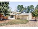 Charming single-Gathering home with a well-manicured lawn, covered entryway, and mature trees at 11647 E Wesley Ave, Aurora, CO 80014