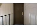 An apartment front door on a plain white wall at 5995 W Hampden Ave # 20B, Denver, CO 80227