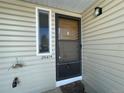 Close-up of front door and window, showcasing the home's welcoming entrance at 2441 S Xanadu Way # A, Aurora, CO 80014