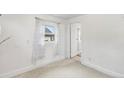 Bright bedroom featuring fresh paint and carpet with a sunny window at 741 Quitman St, Denver, CO 80204