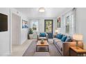 Cozy living room featuring ample natural light, neutral decor, and stylish contemporary furnishings at 741 Quitman St, Denver, CO 80204