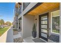 Close-up of the front door, showing modern design and welcoming entry at 3880 W 13Th Ave, Denver, CO 80204
