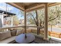 Inviting front porch with cushioned seating and views of the neighborhood at 3353 Wabash St, Denver, CO 80238