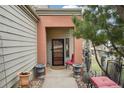 Inviting front porch with neutral pillars, stylish decor, and comfortable seating area at 758 Chimney Creek Dr # C, Golden, CO 80401